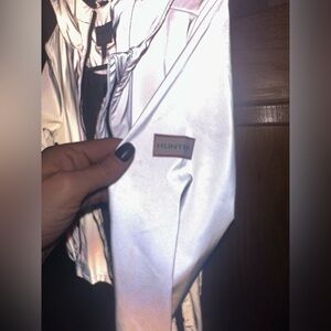 Hunter packable waterproof windbreaker.  Youth size XL. Grey/ reflective